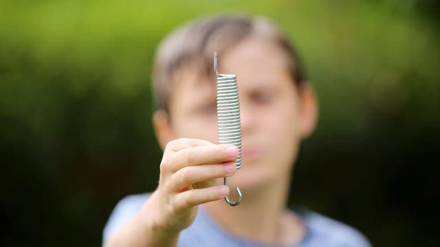 Boy, 12, survives 'freak' trampoline accident after metal spring shot into his back 'like a bullet'