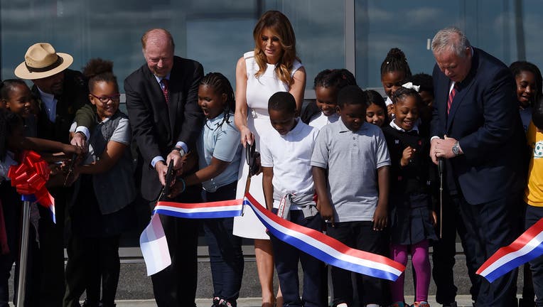 US First Lady Melania Trump participates in the ribbon cutting ceremony with 4th graders from Amidon-Bowen Elementary school during the reopening of the Washington Monument on the National Mallon September 19, 2019 in Washington, DC.