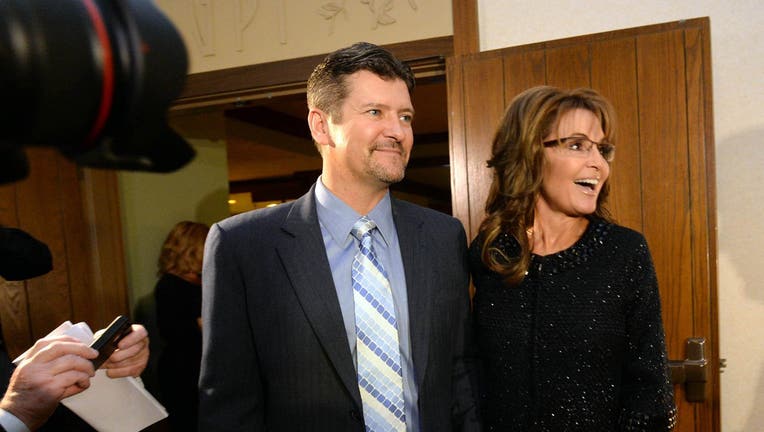 Sarah Palin, right, former Governor of Alaska, and her husband, Todd, arrive at the Grove Park Inn for a celebration of Billy Graham's 95th birthday in Asheville, N.C., on Thursday, Nov. 7, 2013.