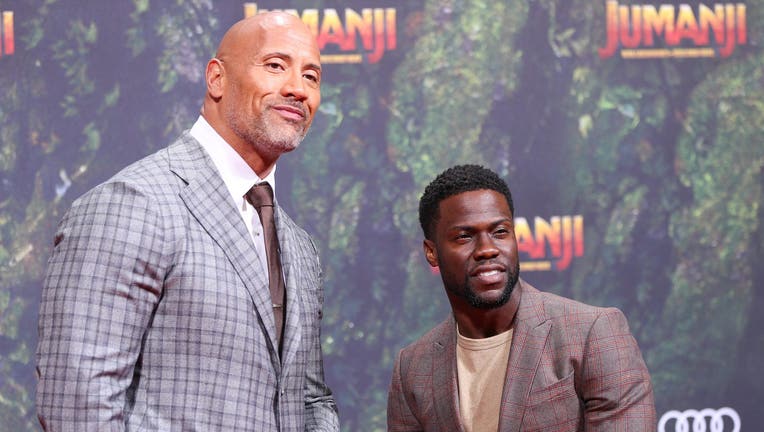 BERLIN, GERMANY - DECEMBER 06: Dwayne Johnson and Kevin Hart arrive at the German premiere of 'Jumanji: Willkommen im Dschungel' at Sony Centre on December 6, 2017 in Berlin, Germany. (Photo by Brian Dowling/WireImage)