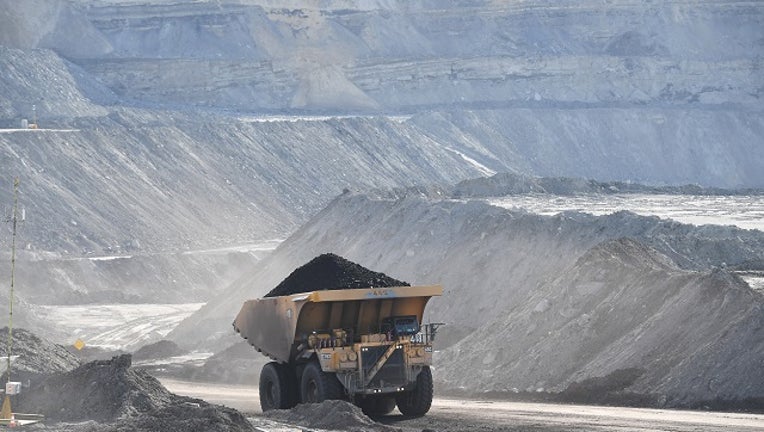 A truck loaded with coal is viewed from the Eagle Butte Coal Mine Overlook in Gillette, WY.