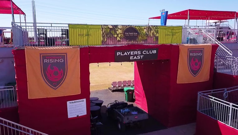 A photo showing one of the entrances to the soccer field at the Casino Arizona Field in Scottsdale, Arizona, home of the Phoenix Rising soccer team. The gate contains the logo for Phoenix Rising.