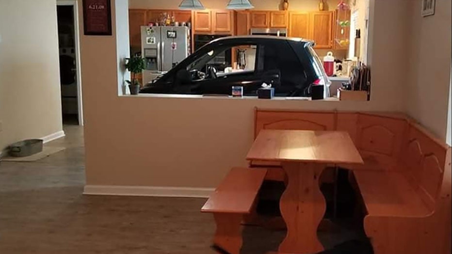 Florida man parks Smart car in kitchen so it won't blow away