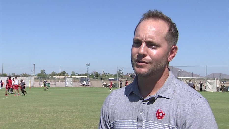 Photo of Bobby Dulle, General Manager of Phoenix Rising. The photo was taken outdoors near a soccer practice field
