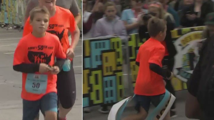 Boy running in marathon