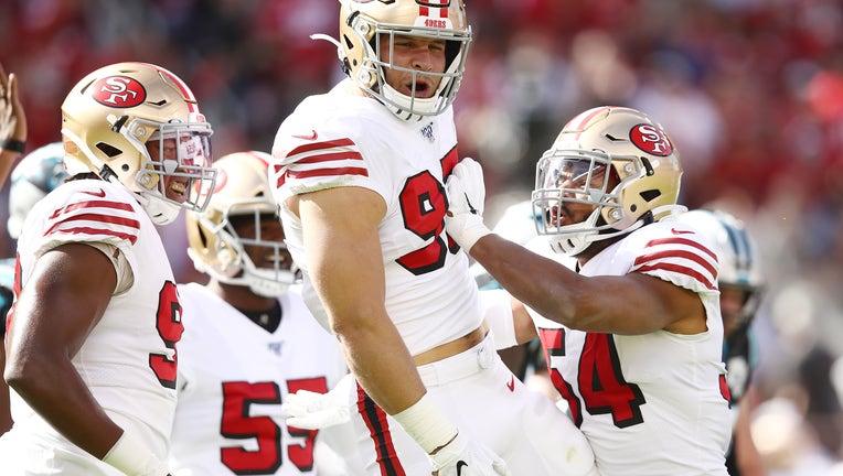 SANTA CLARA, CALIFORNIA - OCTOBER 27: Nick Bosa #97 of the San Francisco 49ers celebrates after sacking Kyle Allen #7 of the Carolina Panthers (not pictured) during the first quarter at Levi's Stadium on October 27, 2019 in Santa Clara, California. (Photo by Ezra Shaw/Getty Images)