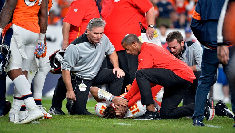 DENVER, CO - OCTOBER 17: Kansas City Chiefs quarterback Patrick Mahomes (15) gets tended to on the ground due to an injury during the second quarter of the game on Thursday, October 17, 2019 at Empower Field at Mile High. The Denver Broncos hosted the Kansas City Chiefs for the game. Photo by Eric Lutzens/MediaNews Group/The Denver Post via Getty Images