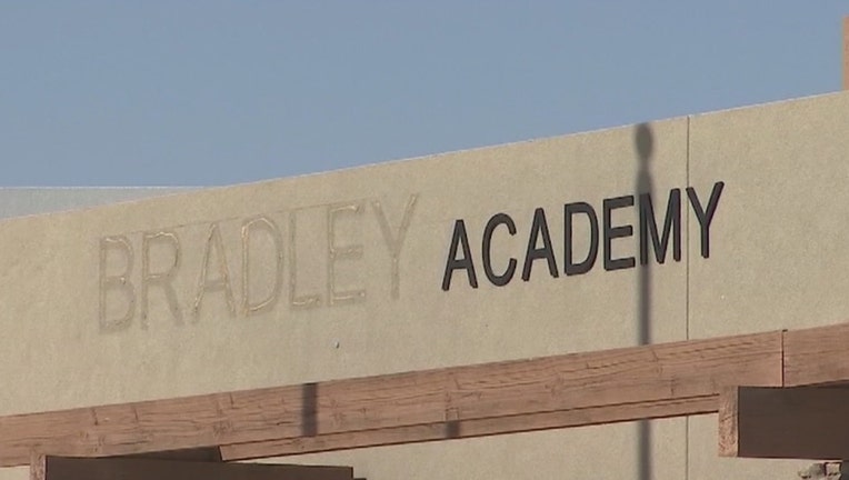 a sign for the now-shuttered Bradley Academy in Goodyear, Arizona