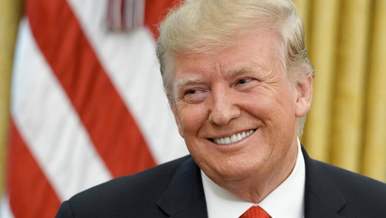 f11e6b7e-GETTY-donald-trump-smile.jpg