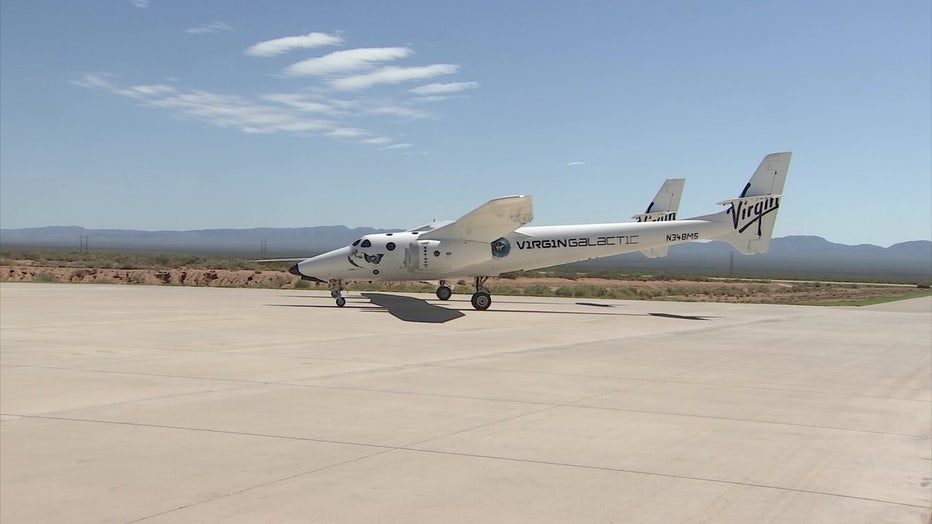 A photo showing the side of a Virgin Galactic spacecraft on the runway in New Mexico