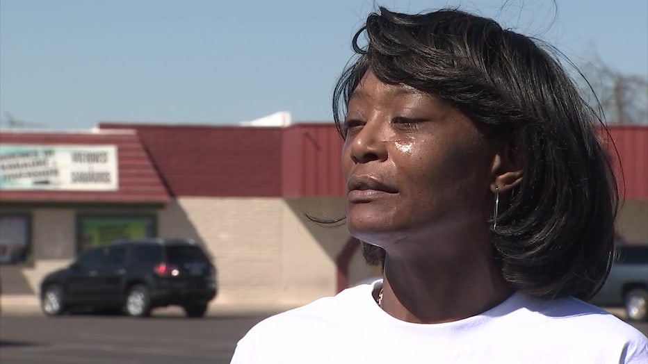 A photo of Courtney Brown, wearing a white shirt. Her husband died while in Phoenix Police custody.