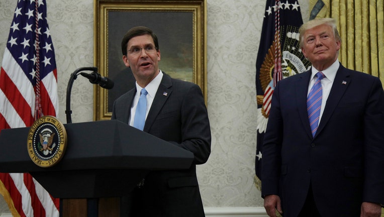WASHINGTON, DC - JULY 23: Mark Esper (L) speaks during his swearing in ceremony to be the new U.S. Secretary of Defense as U.S. President Donald Trump (R) looks on July 23, 2019 in the Oval Office of the White House in Washington, DC. Esper succeed James Mattis to become the 27th U.S. Defense Secretary.(Photo by Alex Wong/Getty Images)