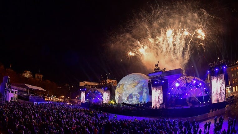 Fireworks are seen during the public show for the 30th anniversary of the fall of the Berlin Wall, on November 9, 2019 at the Brandenburg Gate in Berlin. Germany on Saturday celebrates 30 years since the fall of the Berlin Wall ushered in the end of communism and national reunification.