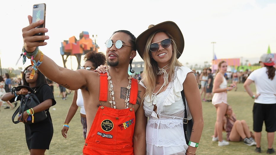 Festivalgoers pose for a selfie at Coachella Music and Arts Festival 2017. Such expressions of self-confidence have been labeled narcissism by some, but new research argues there are benefits to sub-clinical narcissism.