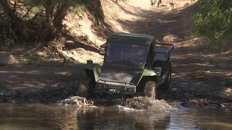 Photo of a finished Tomcar about to ford a creek