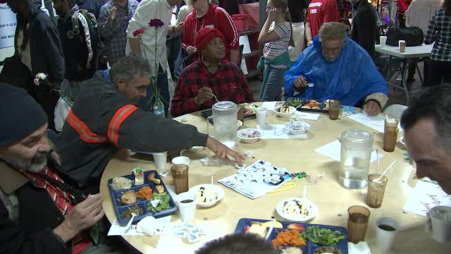 Athletes, musicians serve holiday meals to people in need on Christmas Day