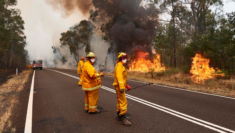CFA Members work on controlled back burns along Putty Road on Nov. 14, 2019 in Sydney, Australia. (Photo by Brett Hemmings/Getty Images)