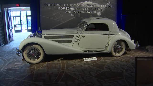 Potential buyers gather for collector car auction at the Biltmore