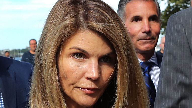 Actress Lori Loughlin leaves a Boston courthouse in August, 2019.