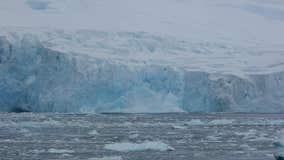 Watch as an iceberg breaks off of an Antarctic glacier