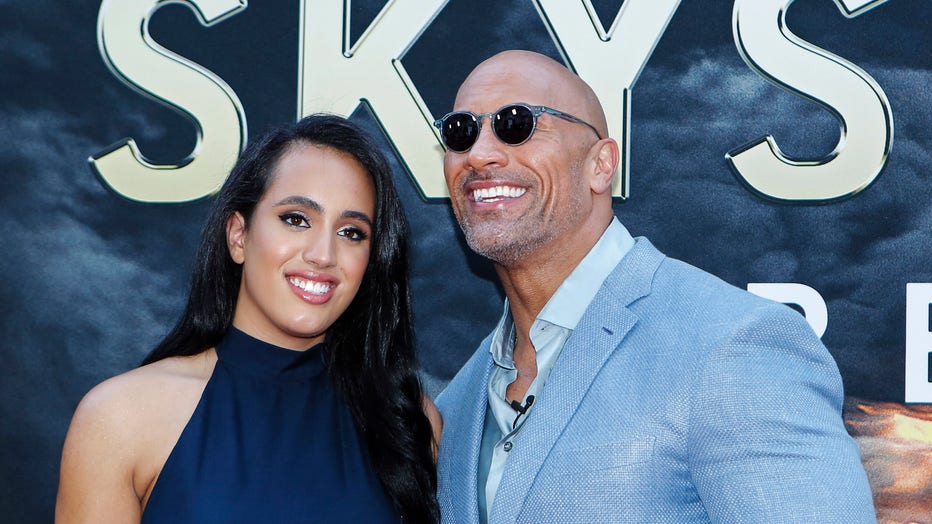 Actor Dwayne Johnson and his daughter Simone Alexandra Johnson attend the premiere of 'Skyscraper' on July 10, 2018 in New York City. (Photo by KENA BETANCUR / AFP) (Photo credit should read KENA BETANCUR/AFP via Getty Images)