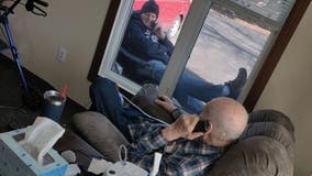 Minnesota man visits elderly father through window, as COVID-19 prohibits in-person visits