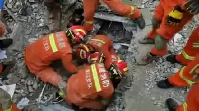 Child pulled from rubble of collapsed quarantine hotel in China
