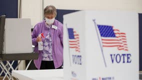 Pandemic politics: Wisconsin voters wait hours at the few open polling stations