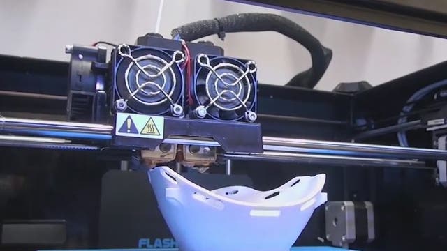 3D printers at Barrow Neurological Institute facility printing masks for medical workers