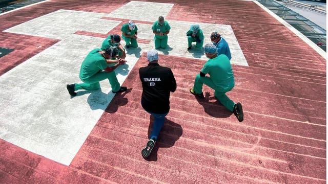 Nurses gather to pray on rooftops during coronavirus pandemic
