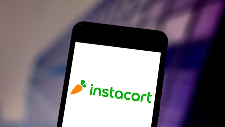 In this photo illustration the Instacart logo is seen