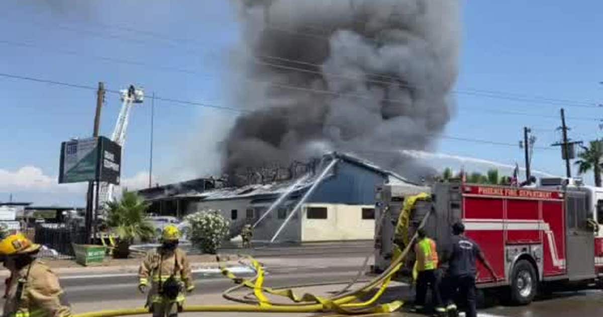 Phoenix firefighters battle two-alarm fire at equipment facility | FOX ...