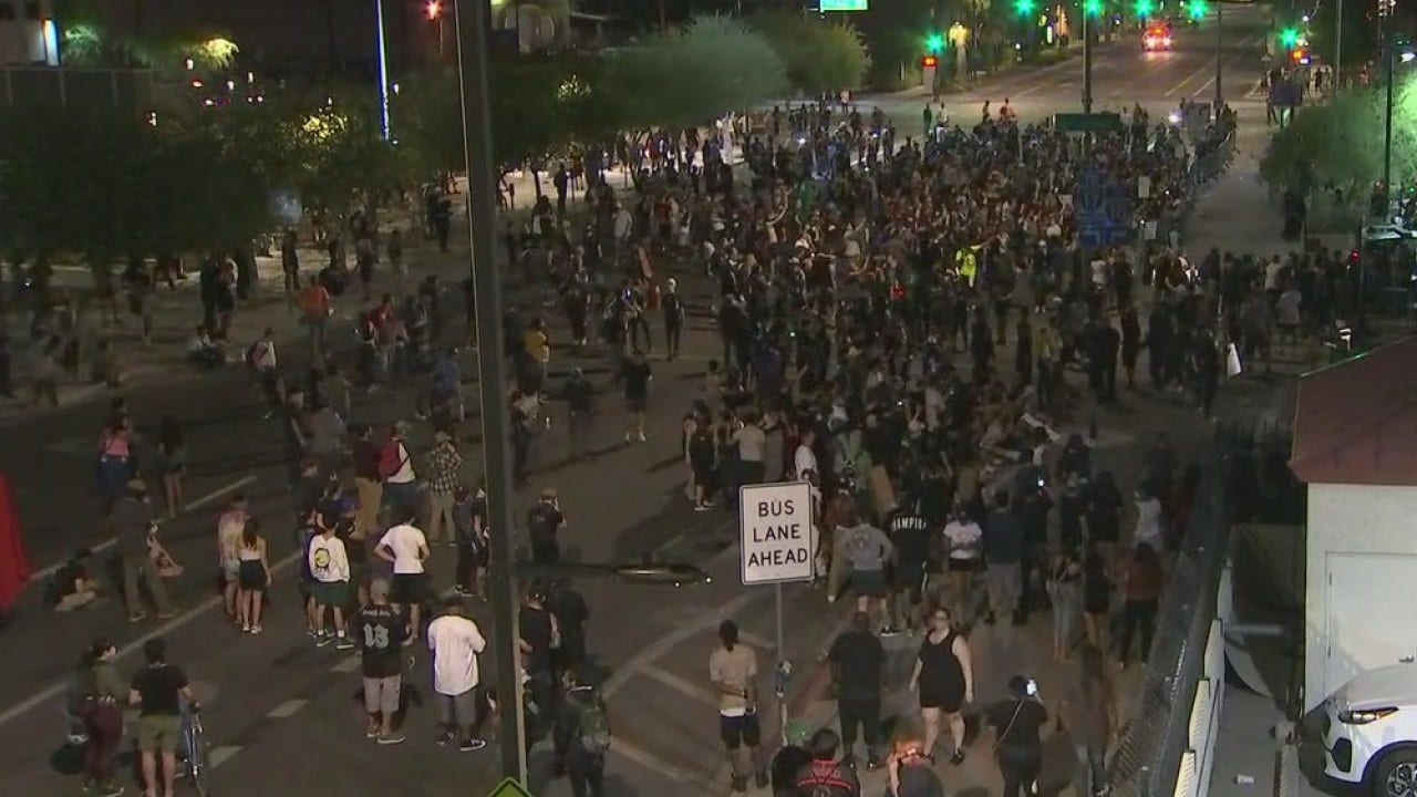 Protesters gather in front of Phoenix Police headquarters