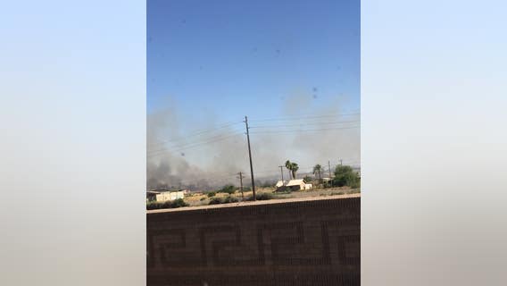 Crews battle grass fire near Chandler by ground and air