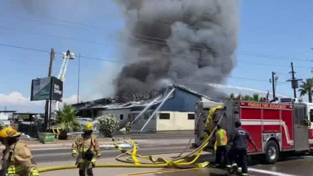 Phoenix firefighters battle two-alarm fire at equipment facility