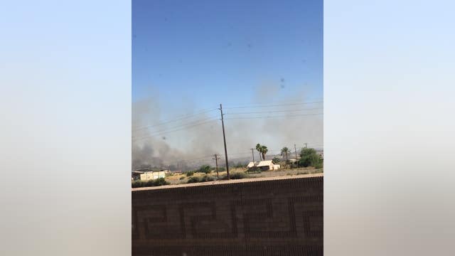 Crews battle grass fire near Chandler by ground and air