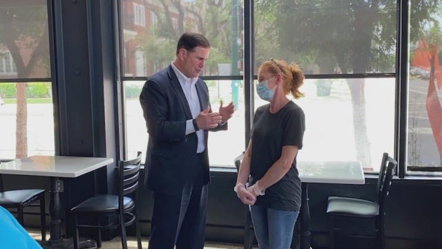 Arizonans receive mixed messaging about wearing masks when Ducey rarely publicly wears one