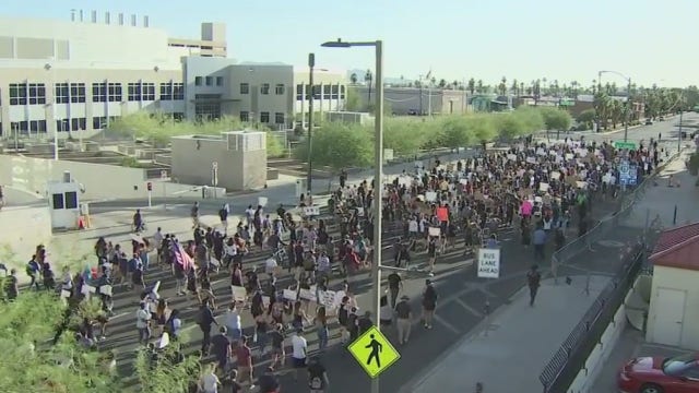 Hundreds take the streets of downtown Phoenix for a 17th consecutive day of protests