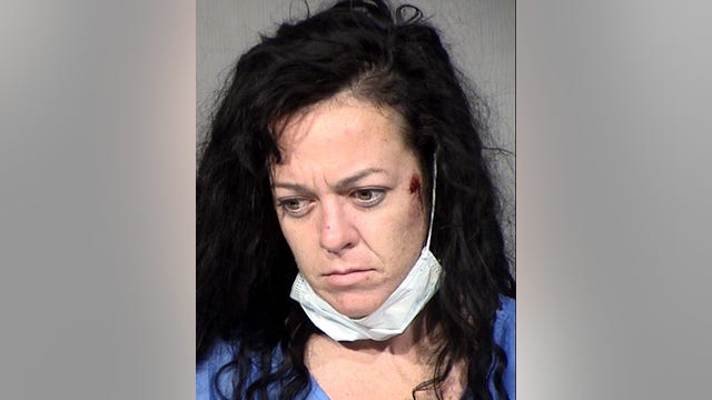 Peoria Police: Woman arrested after running over officer with car
