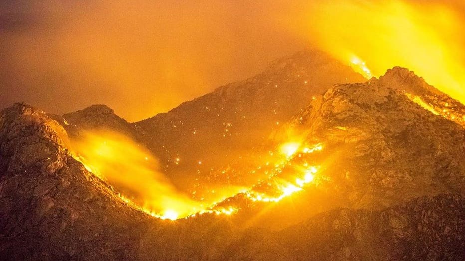 Mountain on fire at night