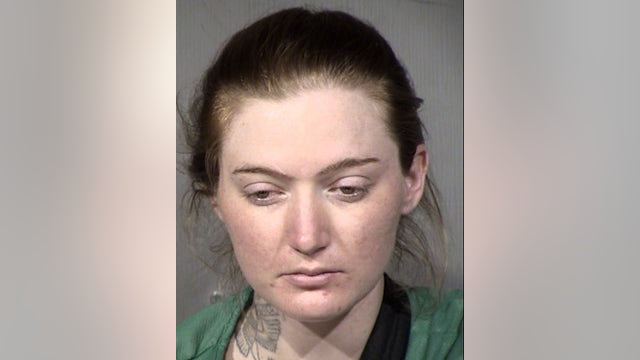 Police investigating officer-involved shooting outside Phoenix motel; woman arrested
