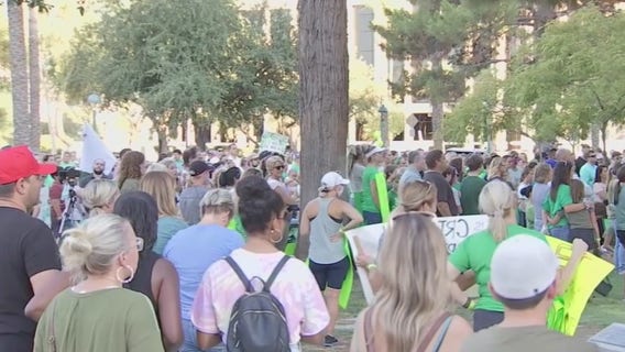 Parents rally for a choice to send kids back to school, saying online class 'isn't sufficient'