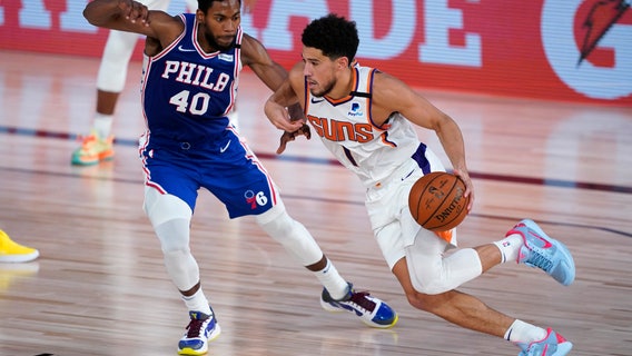 Booker’s 35 points help streaking Suns beat 76ers 130-117, only undefeated team in NBA bubble
