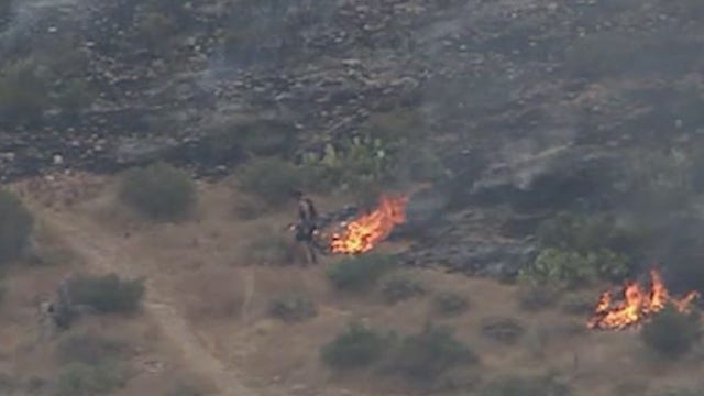 Jogger caught on camera helping to contain wildfire in McDowell Mountains