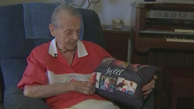 Senior care company gifts Phoenix clients pillows with family pictures on them
