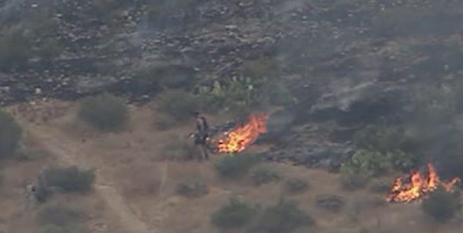 Jogger caught on camera helping to contain wildfire in McDowell Mountains