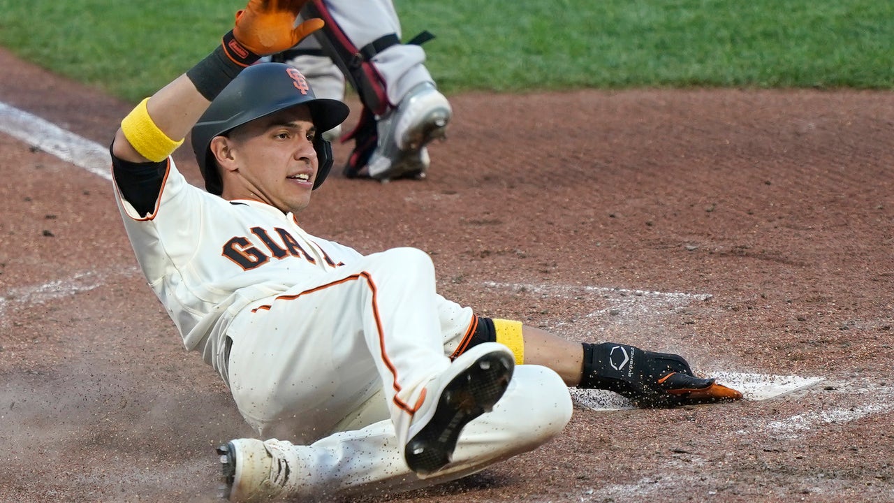 Arizona Diamondbacks' David Peralta goes down after fouling a ball