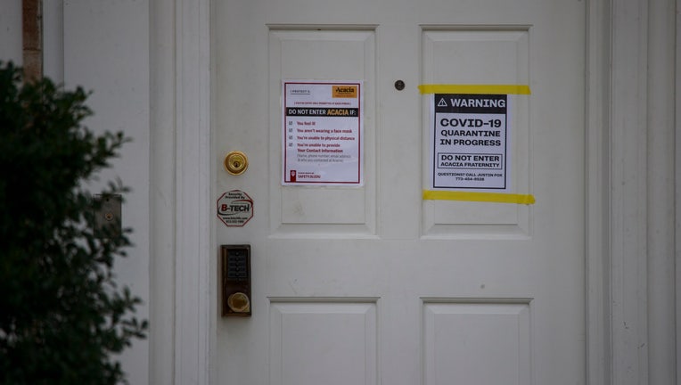 A sign on the door outside the Acacia Fraternity houses