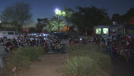High school football players gather after game was cancelled due to COVID-19