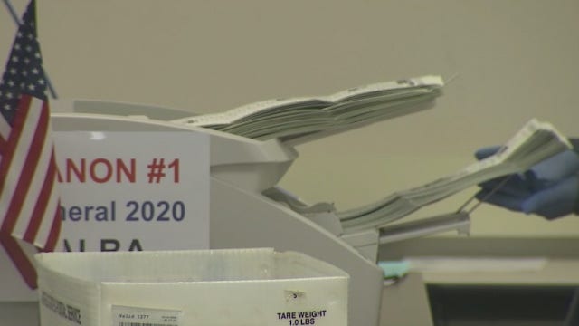 Election workers in Maricopa County processing ballots that have been returned by voters